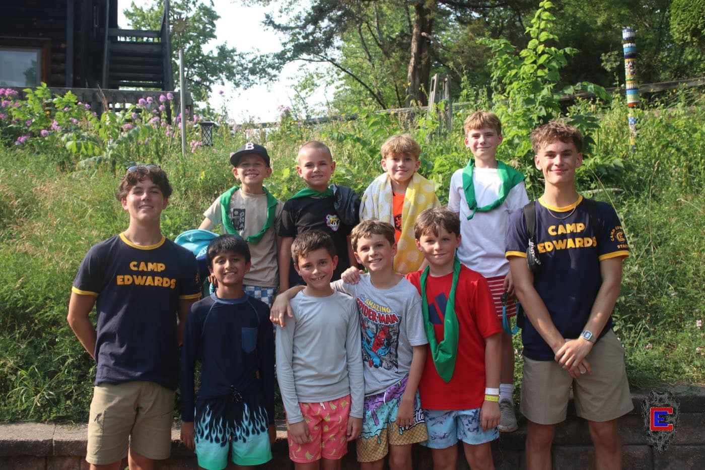The campers in my cabin at YMCA Camp Edwards, photographed with staff in front of the camp garden